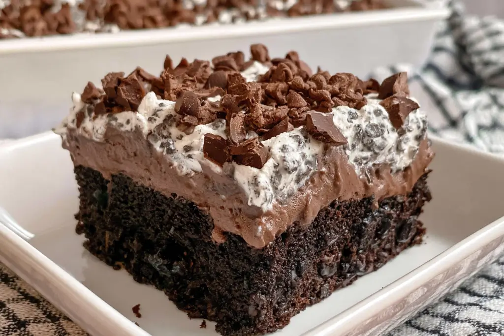 Death by Chocolate Poke Cake with chocolate pudding and whipped cream