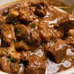 Slow Cooker Beef Tips with Gravy over creamy mashed potatoes