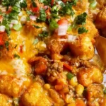 Bacon cheeseburger tater tot casserole with crispy golden tots