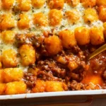 Sloppy Joe Tater Tot Casserole Recipe - Easy Comfort Food Classic 5 Sloppy Joe tater tot casserole with cheesy filling and crispy potato tots