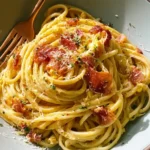 Pasta with egg and bacon in a creamy cheese sauce