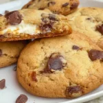 Golden baked chocolate chip cheesecake cookies stuffed with a creamy cheesecake filling.