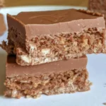 Cadbury Double Decker chocolate bar unwrapped showing the soft nougat and crunchy cereal layers.