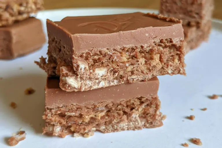 Cadbury Double Decker chocolate bar unwrapped showing the soft nougat and crunchy cereal layers.