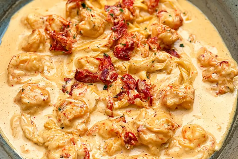 Creamed Lobster Sauce: A Decadent Step-by-Step Guide 3 Rich and velvety creamed lobster sauce served over fresh cooked pasta.