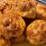 Cream Cheese Sausage Balls: A Delicious Snack Recipe 5 Cream cheese sausage balls baked golden brown on a parchment-lined baking sheet.