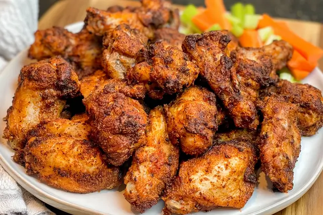 Dry Rub Chicken Wings - Don't Lose This! Perfect Recipe 3 Crispy baked chicken wings evenly coated in a flavorful red spice dry rub.