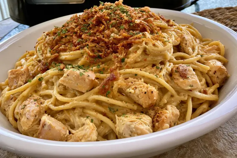 Crockpot Parmesan Garlic Chicken Spaghetti – Easy, Creamy & Delicious Family Dinner 3 Slow cooker creamy parmesan garlic chicken spaghetti garnished with fresh herbs and grated cheese.
