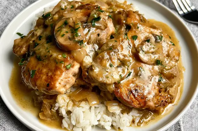 Slow cooker smothered chicken chops cooked in a creamy mushroom gravy.