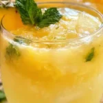 Pineapple Mocktails: Refreshing and Delicious Sips 7 Refreshing pineapple mocktail with ginger beer and lime juice in an ice-filled glass.