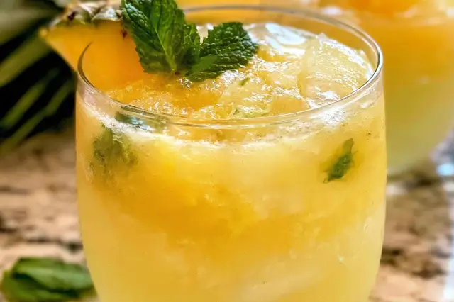 Pineapple Mocktails: Refreshing and Delicious Sips 4 Refreshing pineapple mocktail with ginger beer and lime juice in an ice-filled glass.