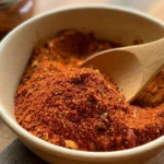 Smack Yo Daddy seasoning blend mixed with paprika, garlic powder, and cayenne pepper.