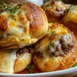 Golden baked biscuit dough bombs brushed with melted garlic butter and grated Parmesan cheese