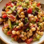 Mixed bean salad tossed with garbanzo, kidney, black, green, and wax beans and vegetables.