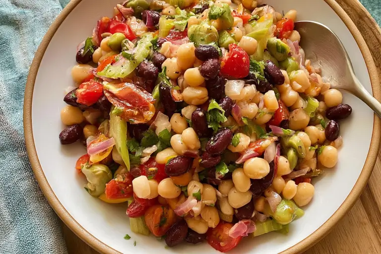 Mixed bean salad tossed with garbanzo, kidney, black, green, and wax beans and vegetables.