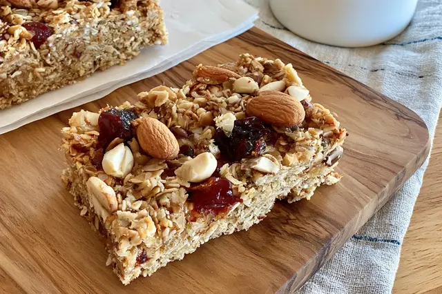 Homemade dried fruit and nut bars made with walnuts, almonds, dates, prunes, and coconut.