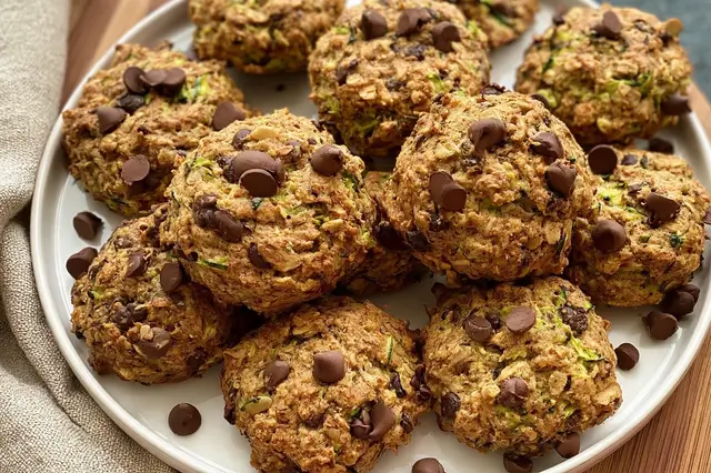 Soft and chewy spiced zucchini cookies baked with grated zucchini, cinnamon, cloves, and raisins.