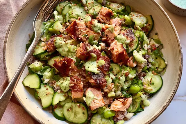 Crispy rice salmon cucumber salad with flaked salmon, avocado, edamame, and creamy Asian dressing.