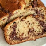 Banana Bread with Nutella Swirl: Decadent Deliciousness Awaits 5 Moist banana bread loaf with rich chocolate hazelnut Nutella swirls throughout the batter.
