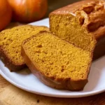 Freshly baked moist Downeast Maine pumpkin bread loaf seasoned with warm autumn spices.