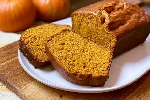 Freshly baked moist Downeast Maine pumpkin bread loaf seasoned with warm autumn spices.