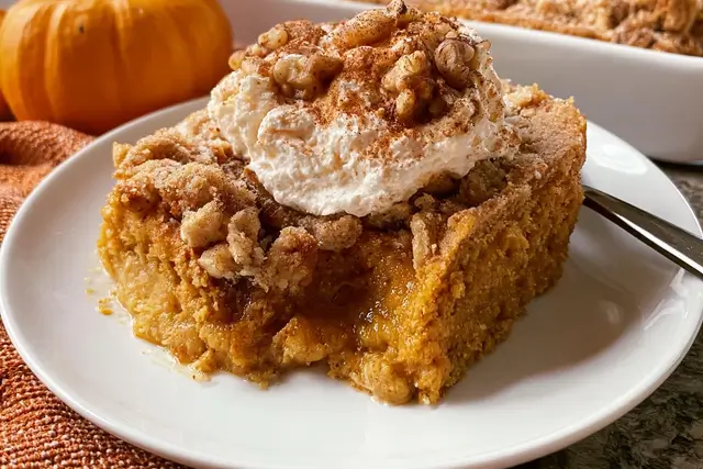 Pumpkin Dump Cake: A Delicious Fall Dessert to Enjoy! 3 Creamy pumpkin dump cake baked with warm spices and crunchy pecans.