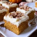 Moist spiced pumpkin bars topped with a thick layer of creamy cream cheese frosting.