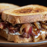 Best Bacon Sandwich with Caramelized Onions Recipe on a Plate