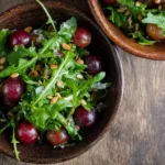 Fresh Arugula Salad with Grapes and Sunflower Seeds Ready to Serve