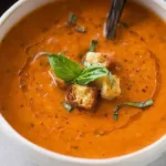 Creamy Tomato Basil Soup in a Bowl Topped with Fresh Basil
