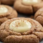 Eggnog Snickerdoodle Thumbprint Cookies on Festive Plate