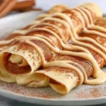 Cinnamon Roll Protein Crepes on a Plate