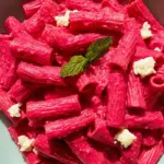 The BEST Pink Sauce Pasta Garnished with Fresh Basil