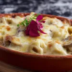 Cheesy Tortellini Bake Served with Garlic Bread