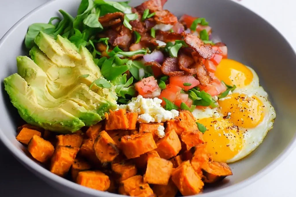 Sweet Potato Breakfast Bowl Garnished with Avocado and Nuts