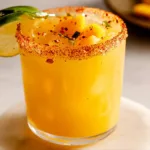 Hot Honey Spicy Mango Margarita in a Vibrant Glass