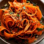 Colorful Raw Carrot Salad on a Fresh Plate