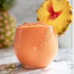 Tropical Sunrise Protein Smoothie in a Glass