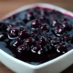 Fresh Blueberry Sauce Drizzled Over Pancakes