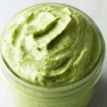 Creamy Pesto Sauce: A Deliciously Rich Flavor Experience 5 Creamy Pesto Sauce Served Over Pasta