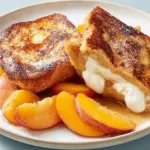Mascarpone Stuffed French Toast with Peaches on a Plate
