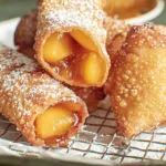 Delicious Peach Cobbler Egg Rolls on a Plate
