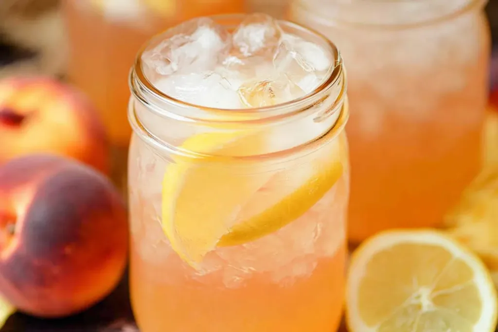 Delicious Peach Lemonade in a Glass with Ice