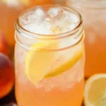 Delicious Peach Lemonade in a Glass with Ice