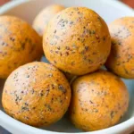 No-Bake Healthy Pumpkin Pie Energy Balls on a Wooden Plate