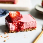 Beautiful No Bake Strawberry Cheesecake Bars on a Plate