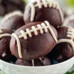 Oreo Football Truffles: The Perfect Game Day Treat! 5 Oreo Football Truffles on a Game Day Table