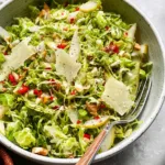 Shaved Brussels and Pear Salad with Manchego: A Fresh Delight 5 Shaved Brussels and Pear Salad with Manchego on a Plate