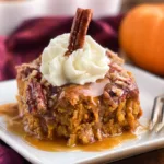Pumpkin Dump Cake Served Warm with Whipped Cream