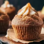 Delicious Spiced Pear Muffins on a Wooden Table